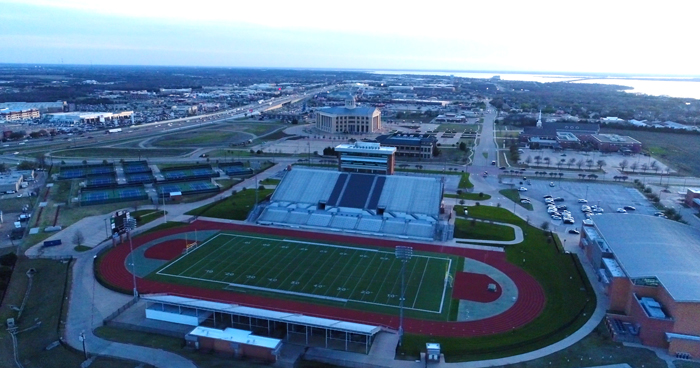 Aerial view of a high school football stadium in Rockwall, TX